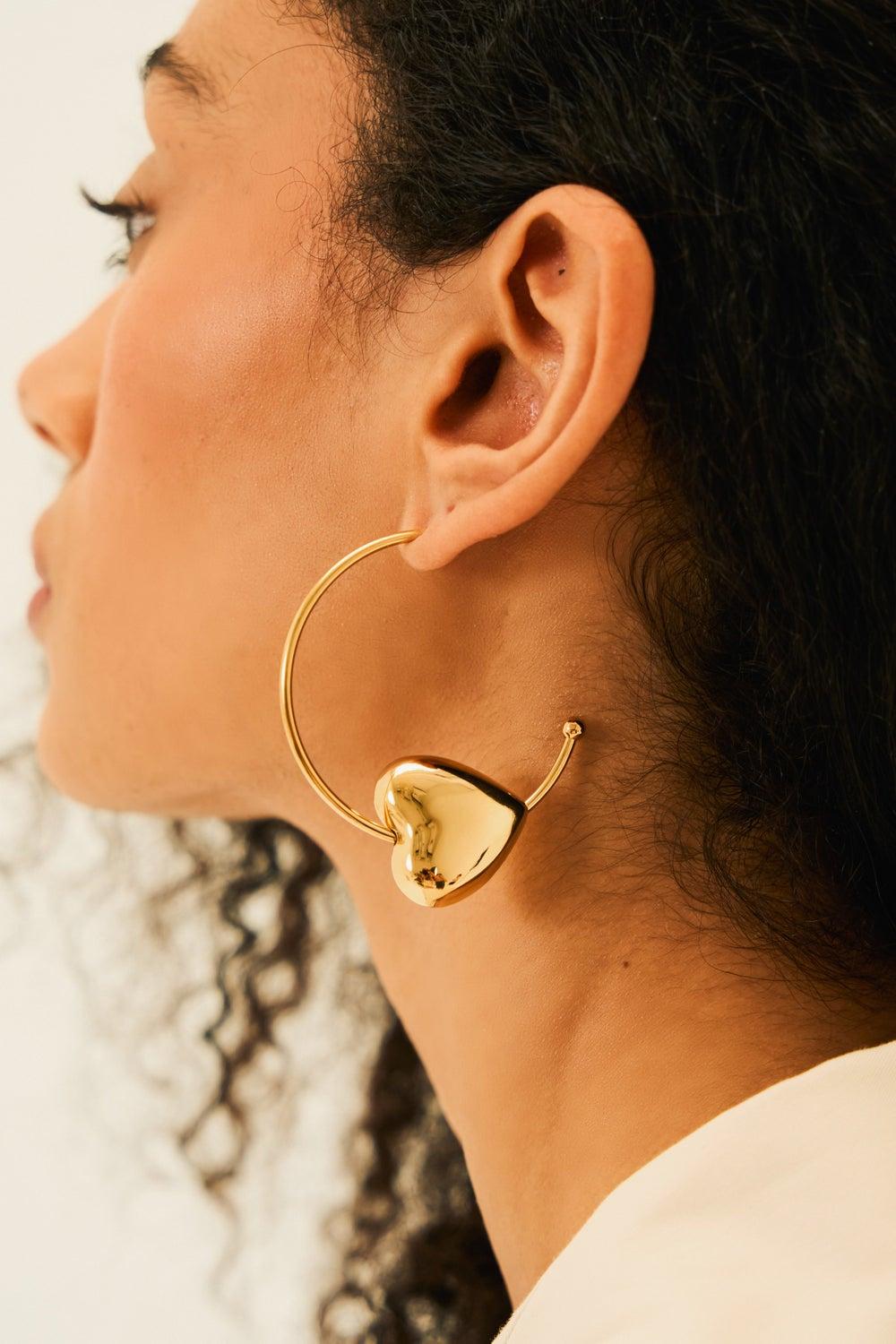 Noya Amora Golden Hoop Earrings - Radiant Love Design - Image 1