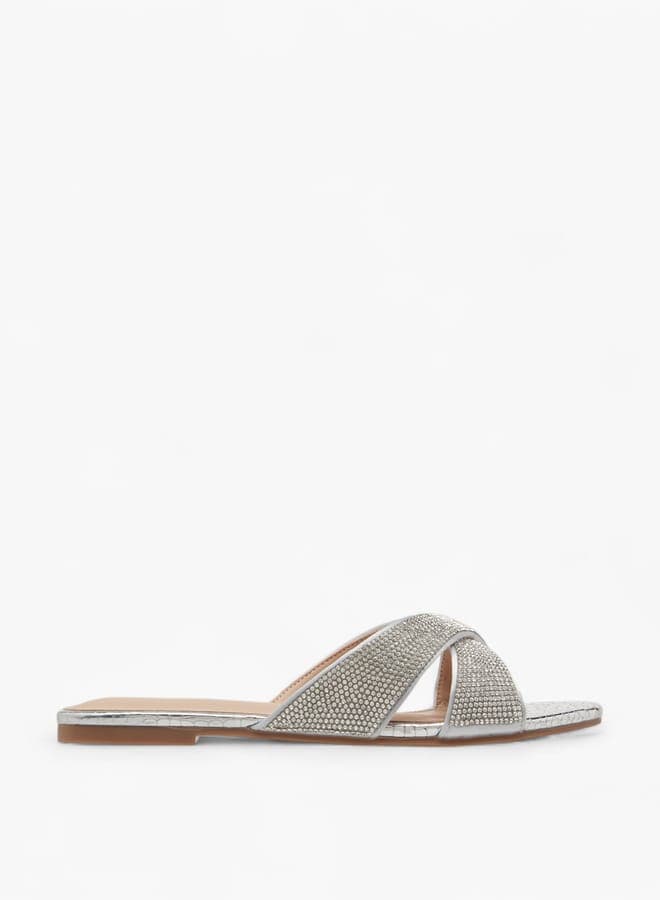 Elegant Silver Slip-On Flat Sandals with Embellished Cross Straps - Image 1