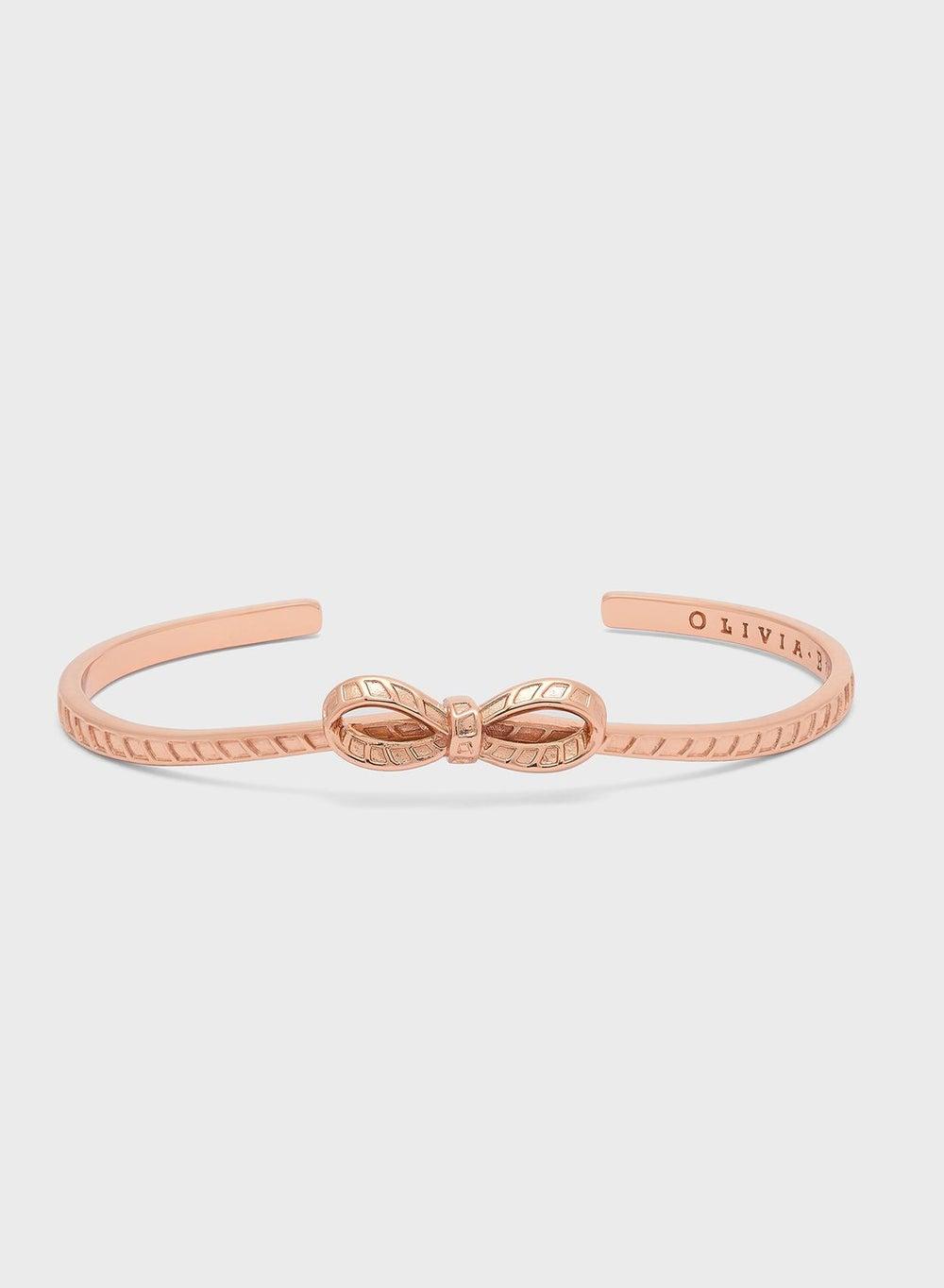 OLIVIA BURTON Elegant Brass Bow Bangle Bracelet - Image 1