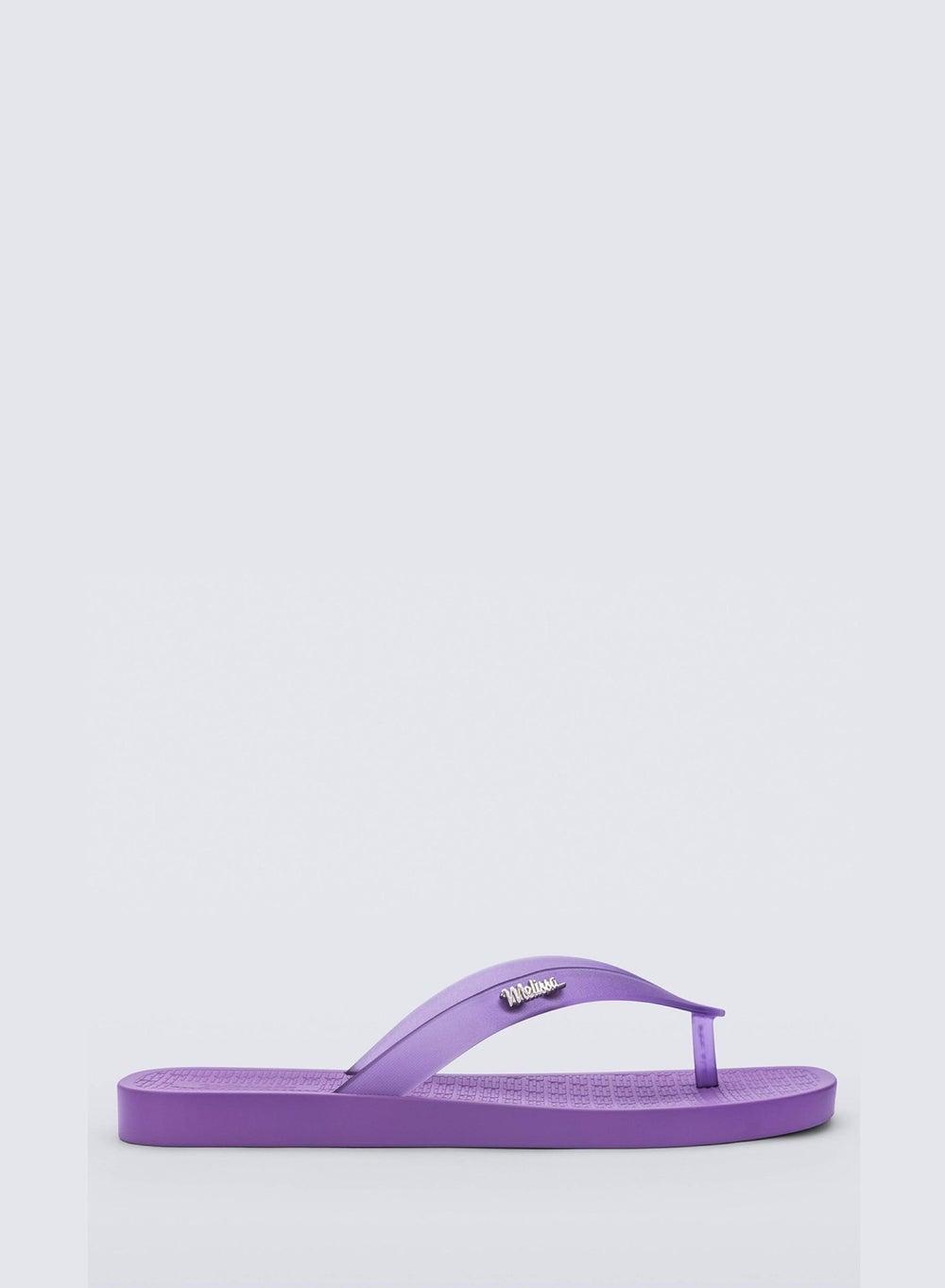 Melissa Sun Long Beach Ad: Elegant Lilac Flip-Flops - Image 1
