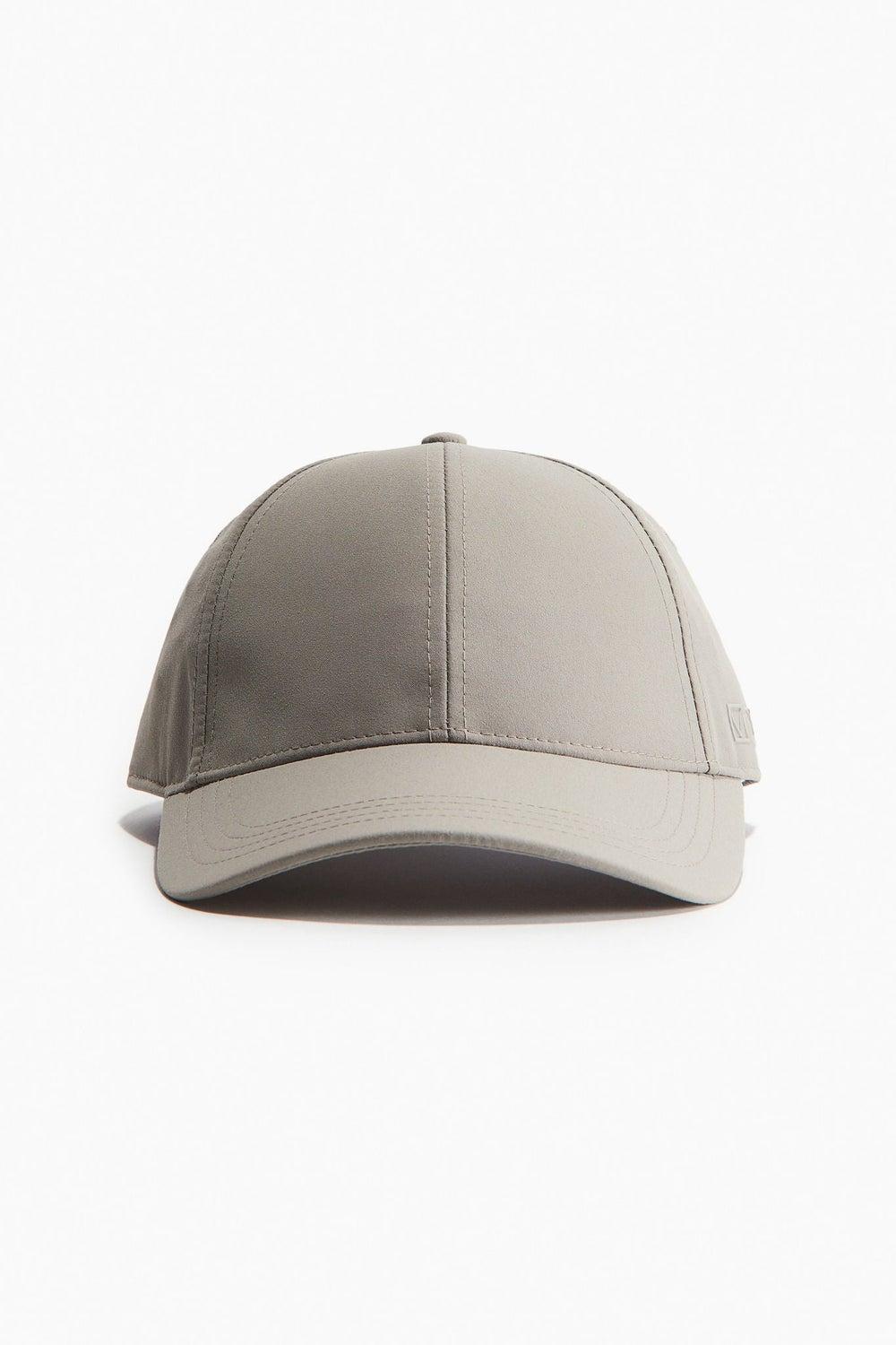 H&M Chic Water-Repellent Cap - Perfect for Outdoor Sports - Image 1