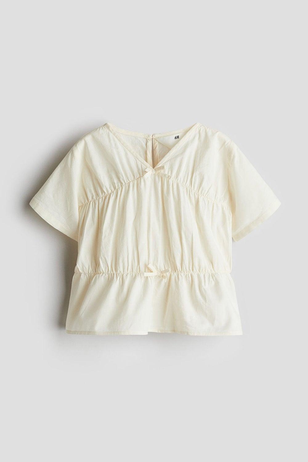 Ivory Peplum Cotton Blouse with Bow Detail - Image 1