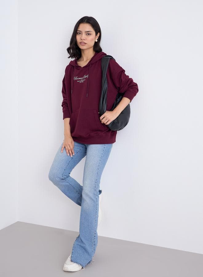 Styli Burgundy Oversized Slogan Hoodie - Image 1