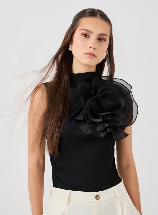 Black Sleeveless High Neck Top with Flower Corsage - Image 1