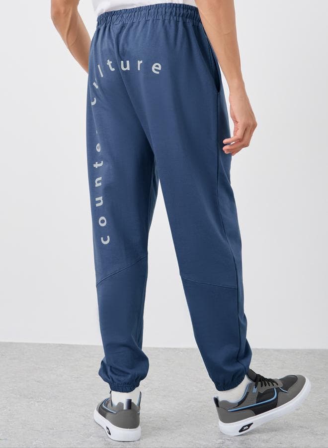 Blue Slogan Print Oversize Jogger Pants Drawstring Fit - Image 1