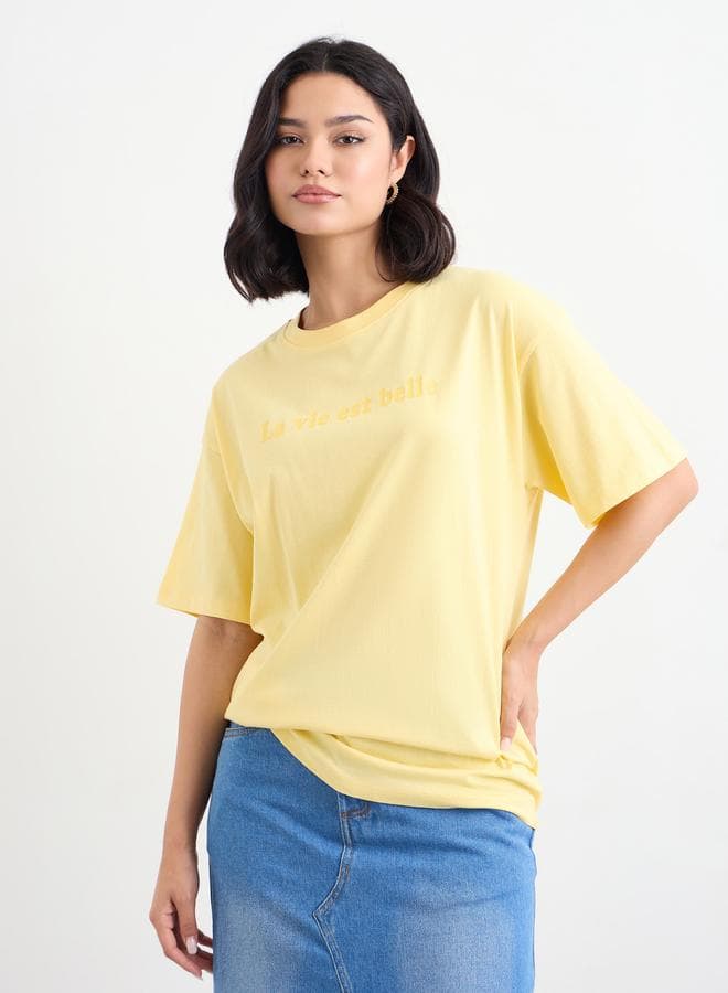 Styli Yellow Slogan Print Oversized Longline T-Shirt - Image 1