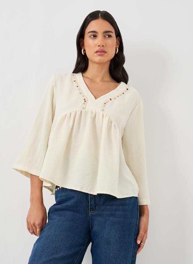 Beige Lace Detail V-Neck Peplum Blouse - Image 1