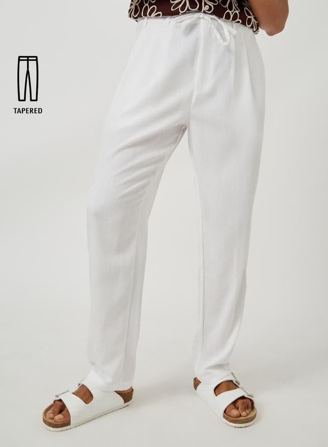 Styli White Textured Pleated Tapered Trousers - Image 1