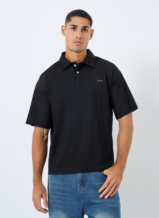 Black Oversized Polo Shirt for Men Button Detail - Image 1