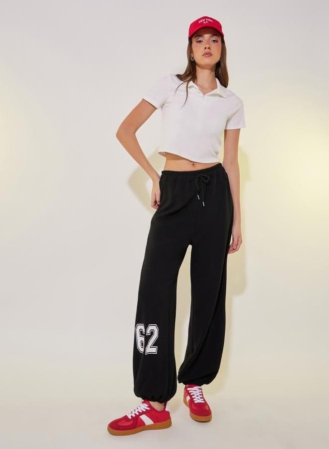 Black Graphic Print High-Rise Cuffed Joggers - Image 1