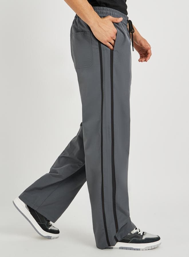 Styli Oversized Grey Jogger Pants with Side Tape - Image 1