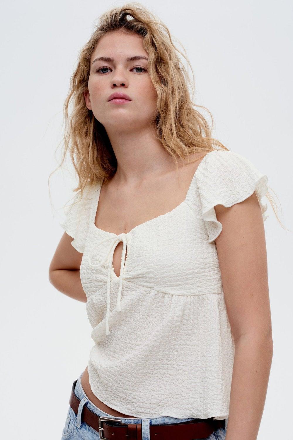 White Light Crinkled Flutter Sleeve Peplum Top - Image 1