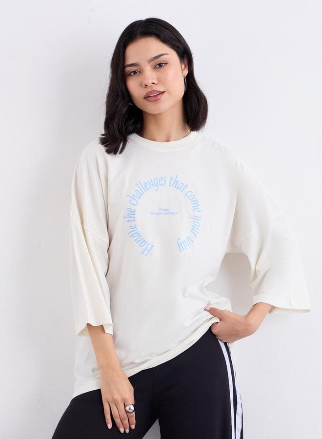 Styli Cream Oversized Slogan Cotton T-Shirt - Image 1