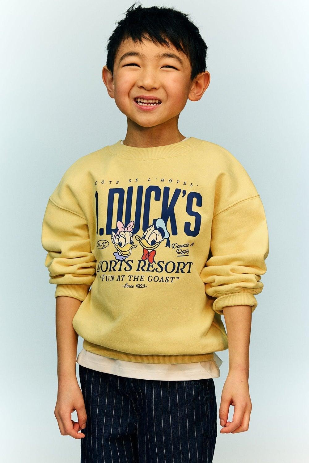 Girls Oversized Printed Sweatshirt in Dusty Yellow - Image 1