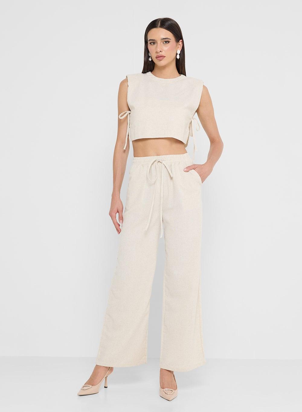 Off-White Sleeveless Top & Flowing Pants Set - Image 1