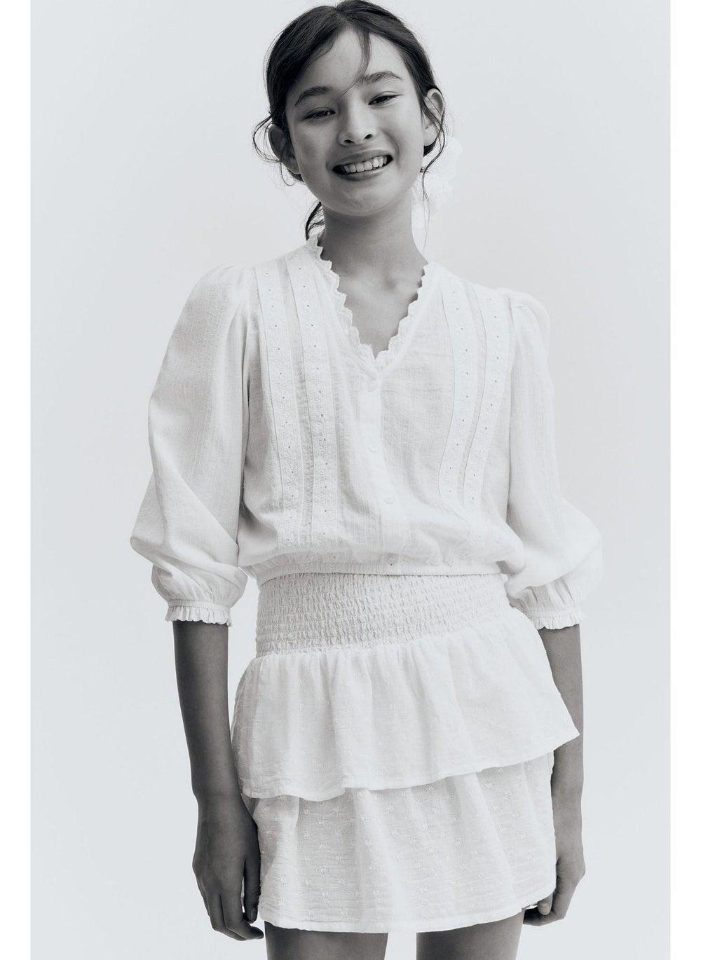 Girls Light White Smocked Tiered Mini Skirt - Image 1