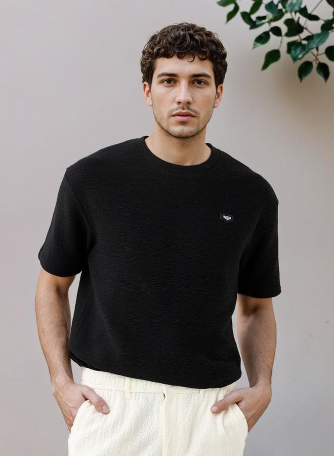 Iconic Oversized Textured Black T-Shirt - Image 1