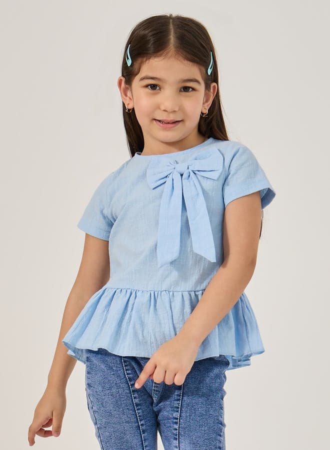 Styli Solid Ruffled Hem Bow Detail Top - Image 1