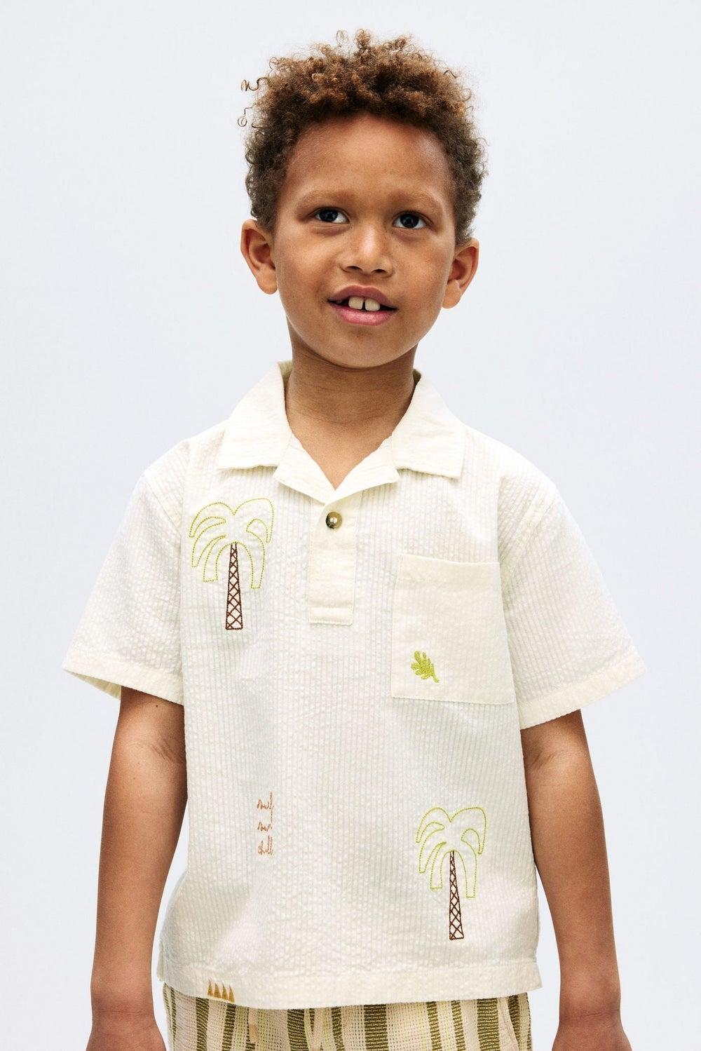 Cotton Seersucker Polo Shirt with Embroidered Motifs - Image 1