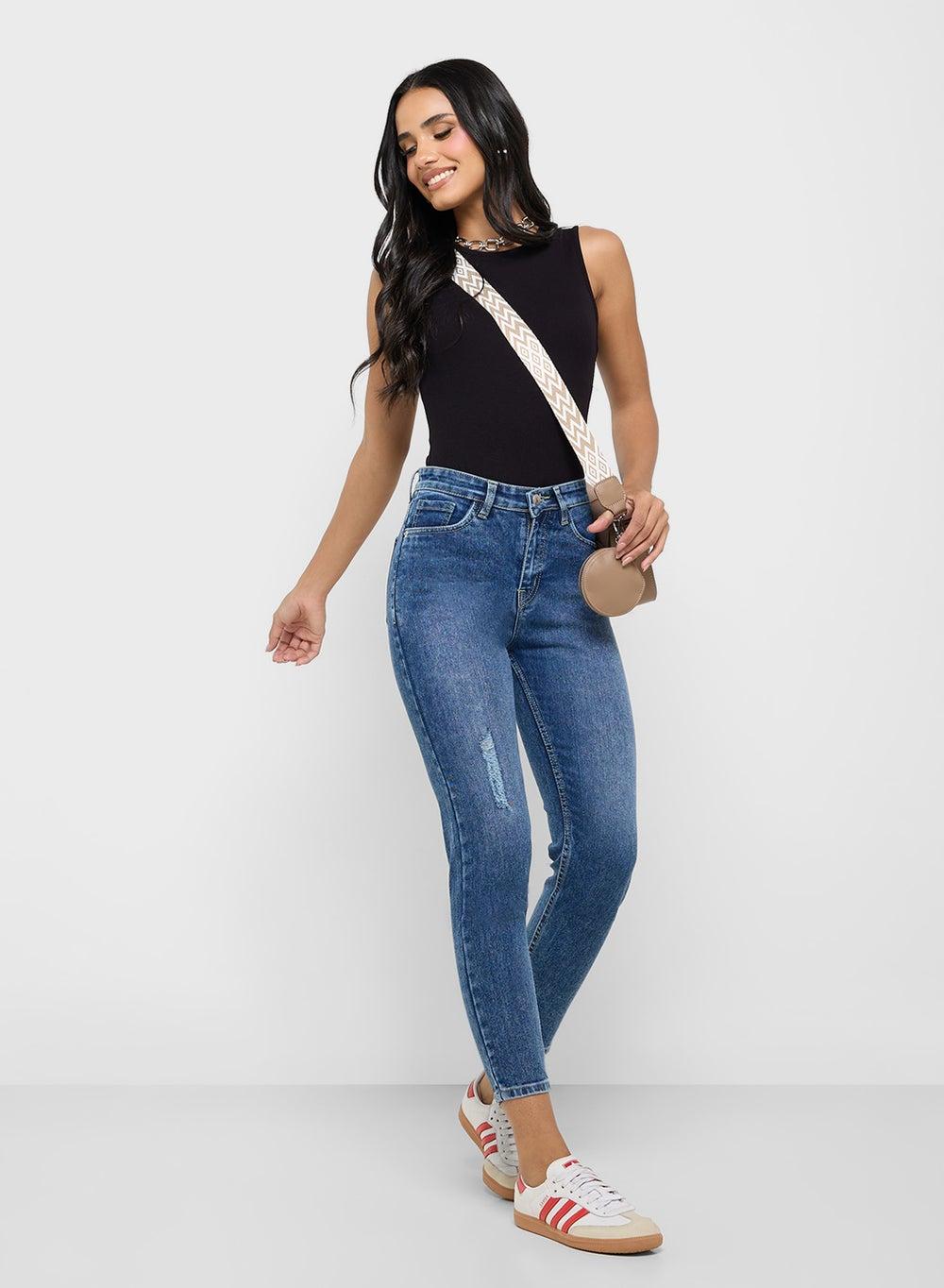 Distressed Mid Rise Skinny Jeans for Modern Edge - Image 1