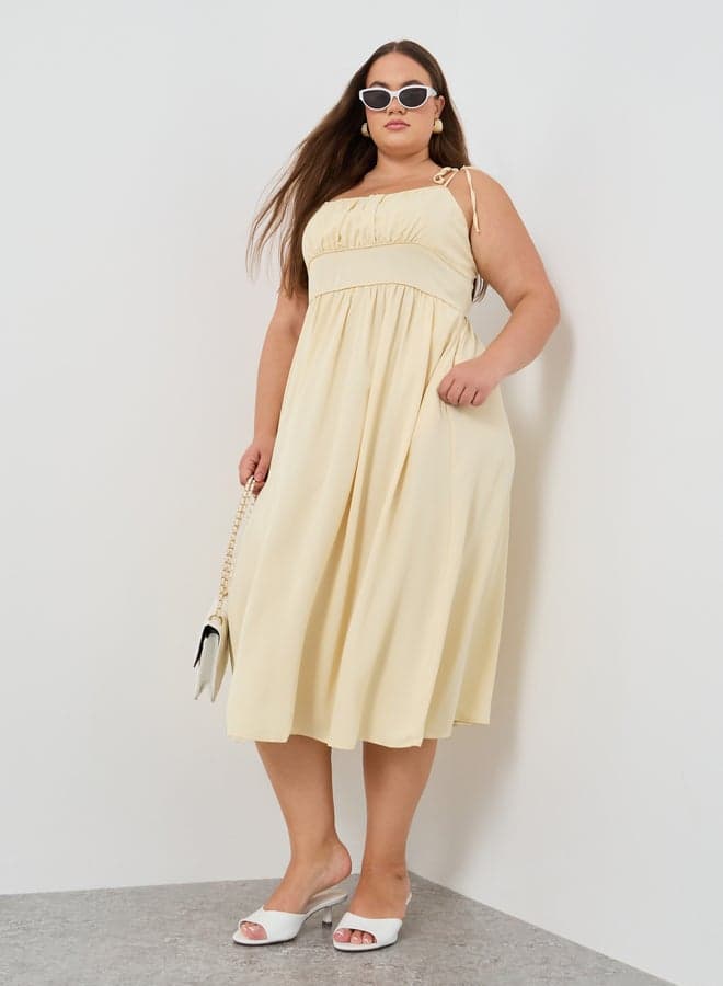 Cream Tie Strap Midi Dress with Flowing Silhouette - Image 1