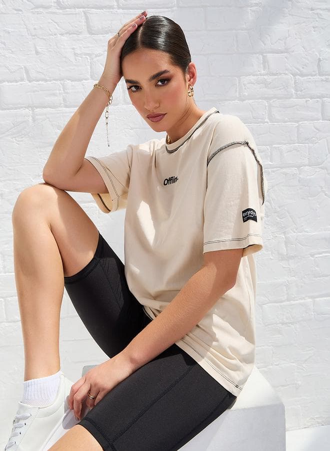 Styli Oversized Drop Shoulder Slogan T-Shirt with Exposed Seam - Image 1