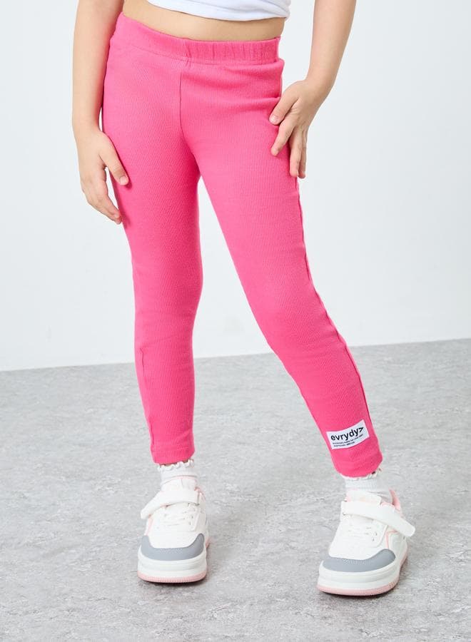 Girls Pink Ribbed Leggings with Badge Detail - Image 1