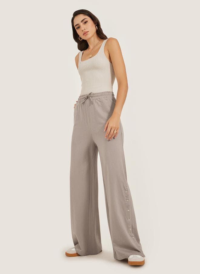 Solid Side Snap Button Hem Joggers - Image 1