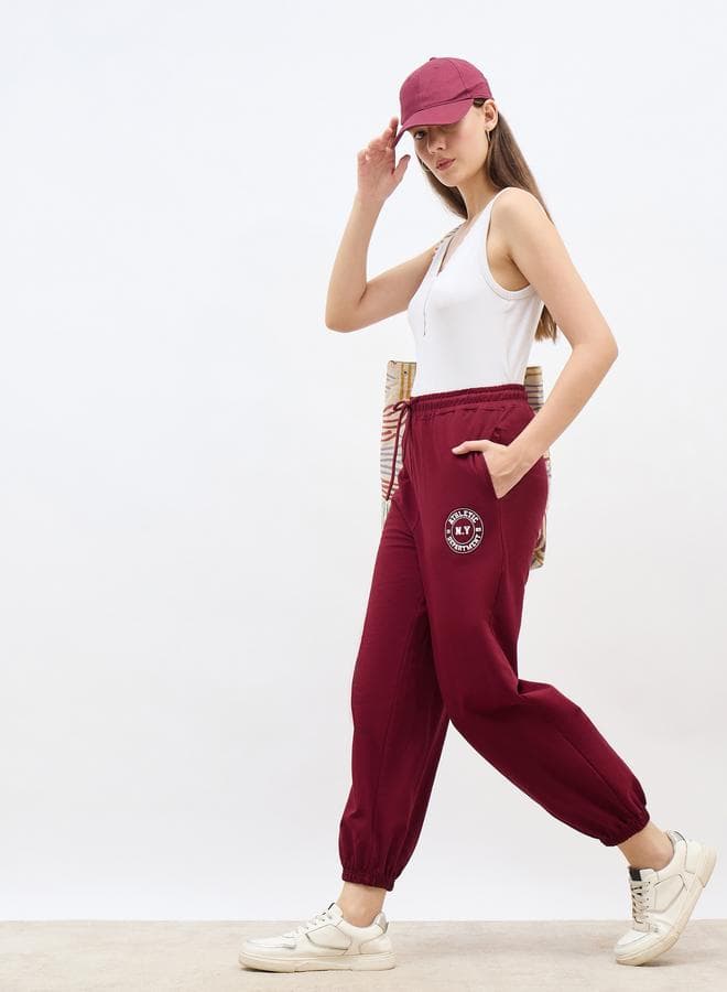 Styli Burgundy Graphic Print Tapered Joggers - Image 1