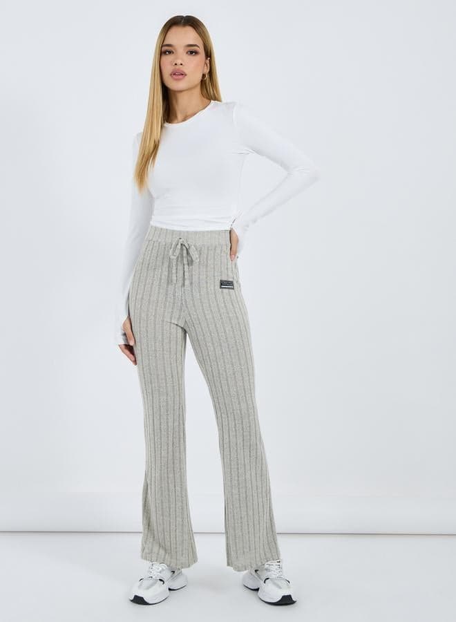 Styli High Rise Ribbed Flared Pants with Patch Detail - Image 1