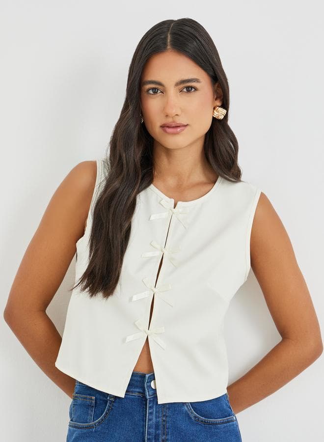 Styli Bow Tie Front Sleeveless Slit Crop Top - Image 1