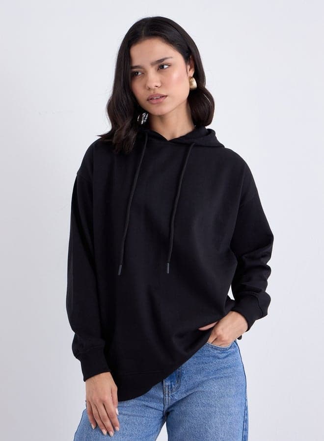 Styli Black Longline Slogan Print Hoodie - Image 1