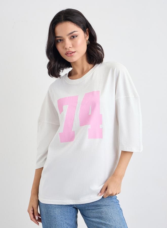 Styli Women Off White Exaggerated Shoulder Oversized Graphic T-Shirt - Image 1