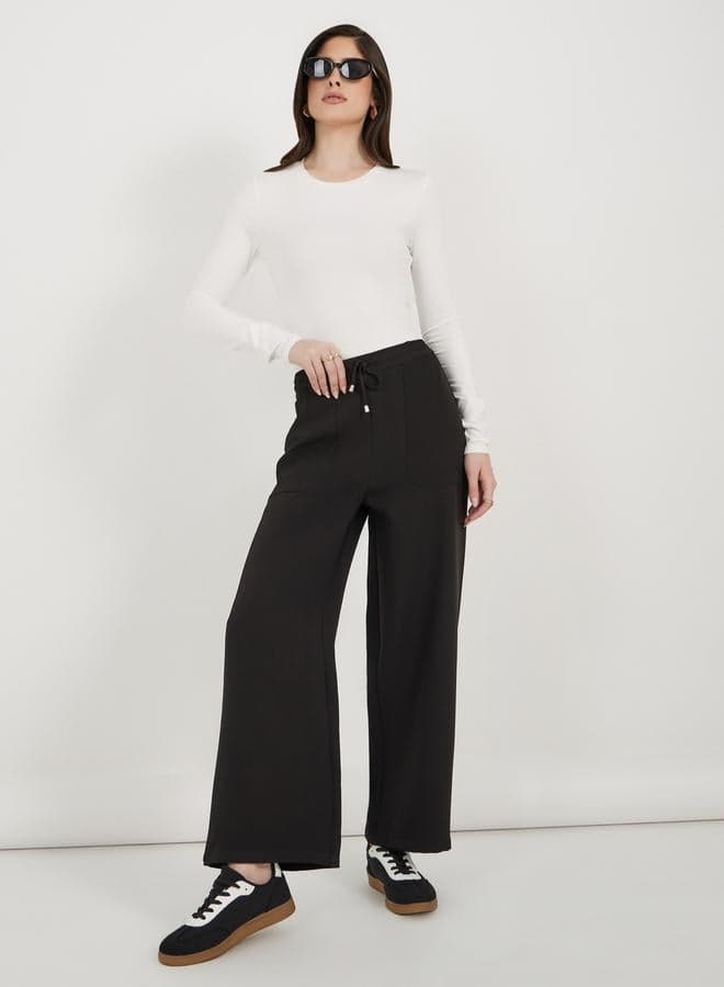 High Rise Tapered Black Pants with Drawstring Waist - Image 1