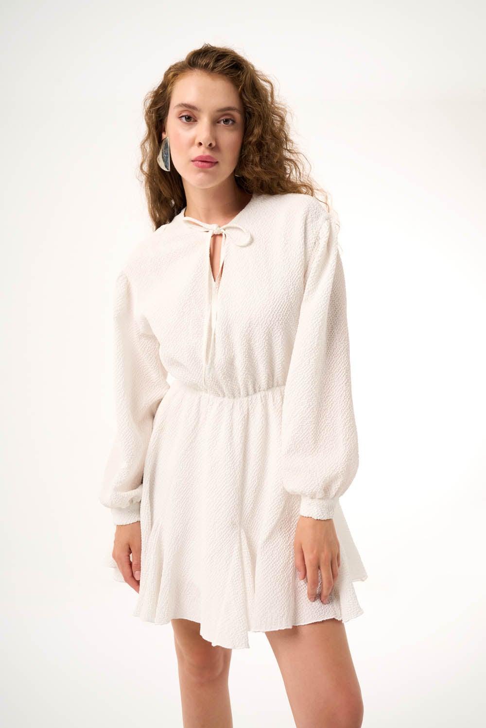 Textured White Mini Dress with Tie Neckline - Image 1