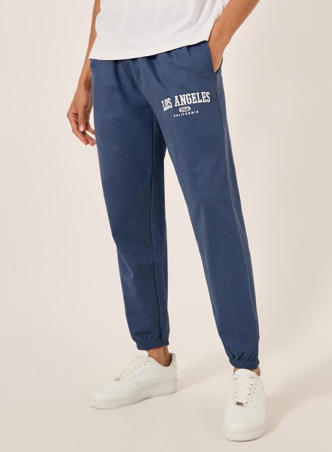 Styli Embroidered Slogan Mid Rise Relaxed Fit Joggers - Image 1
